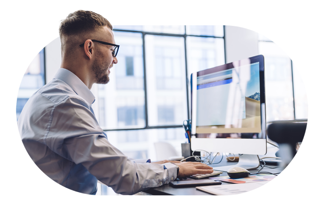 Image of a man typing on his laptop